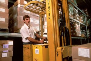 A man operates a forklift