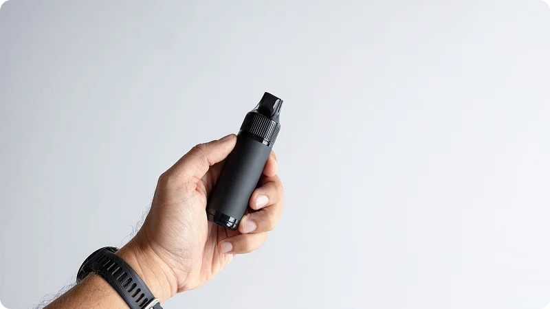 A hand holding an E cigarette.